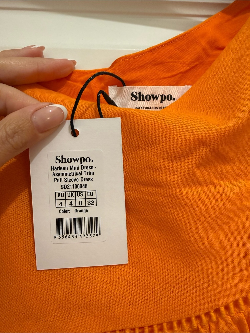 SHOWPO | Harleen Mini Dress
Linen Asymmetrical Trim Puff Sleeve Dress In Orange - Picture 8 of 8